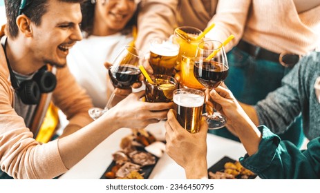 Multiracial friends celebrating party drinking cocktails at bar restaurant - Young people having fun hanging out on weekend day - Life style concept with guys and girls enjoying time together - Powered by Shutterstock