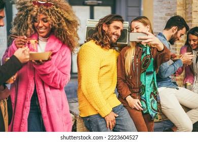 Multiracial Friends Doing Selfie With Mobile Phone Outside Food Truck Restaurant - Focus On Center Couple Face