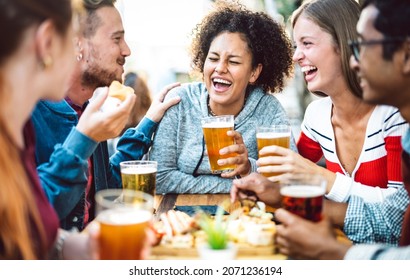 Multiracial Friends Drinking Beer At Brewery Pub Garden - Genuine Friendship Life Style Concept With Guys And Girls Enjoying Happy Hour Food Together At Open Air Bar Dehor - Warm Vivid Filter