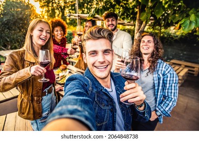 Multiracial Friends Group Taking Selfie At Barbecue Dinner Time - Young People Chilling Outside Eating And Drinking Red Wine On Patio Terrace House - Food And Youth Friendship Concept