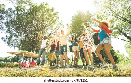 Multiracial Friends Having Fun At Barbecue Pic Nic Garden Party - Friendship Multicultural Concept With Young Happy People Drinking And Dancing Out At Spring Break Camp - Sunshine Halo Greenery Filter