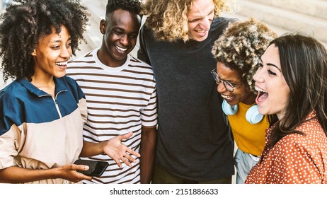 Multiracial Friends Having Fun Laughing Together Outside - Group Of Young People Socializing Talking And Joking On Urban Street - Youth Community Concept With Guys And Girls Meeting In City Center 