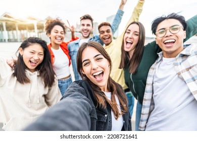 Multiracial Friends Taking Selfie Group Picture With Smart Mobile Phone Outside On City Street - Happy Young People Smiling Together Looking At Camera - Youth Lifestyle Concept With Teens Hanging Out