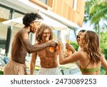 Multiracial friends toasting beer and cocktail bottle at pool party,  Young people having fun together outside , Food and beverage life style concept with guys and girls drinking alcohol on summer 