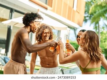 Multiracial friends toasting beer and cocktail bottle at pool party,  Young people having fun together outside , Food and beverage life style concept with guys and girls drinking alcohol on summer  - Powered by Shutterstock