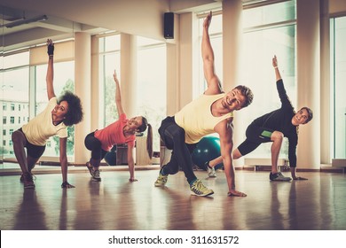 Multiracial group during aerobics class