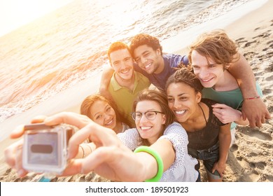 Multiracial Group Of Friends Taking Selfie At Beach