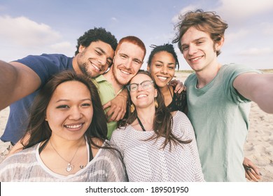 Multiracial Group of Friends Taking Selfie at Beach - Shutterstock ID 189501950