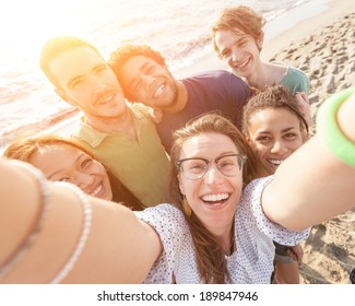 Multiracial Group Of Friends Taking Selfie At Beach