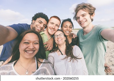 Multiracial Group of Friends Taking Selfie at Beach - Shutterstock ID 202060255