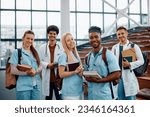 Multiracial group of happy students of medicine in lecture hall looking at camera. 