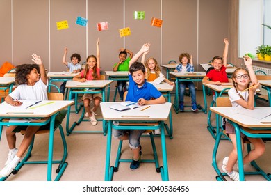 Multiracial Group Of Kids At Primary School - Playful Schoolers Enjoying School Time And Lesson With Teacher And Classmates