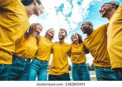 Multiracial group of people hugging outdoors - Happy friends having fun hanging outside - Youth community concept with guys and girls supporting each other - Shutterstock ID 2282803491