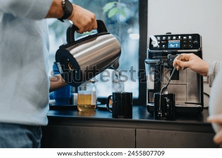 Multiracial group strategizing, discussing statistics in a corporate office. Colleagues take a break, have tea, collaborate, work together towards success.