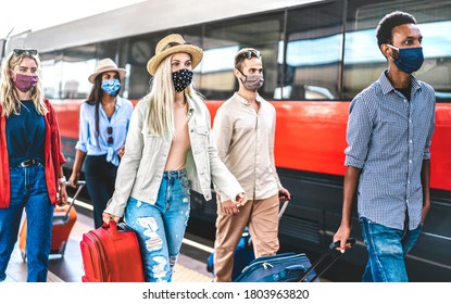 Multiracial Group Walking At Railway Station Platform - New Normal Travel Concept With Young People Covered By Protective Mask - Focus On Blond Girl With Hat