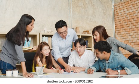 Multiracial Group Of Young Creative People In Casual Wear Meeting Brainstorming Ideas About New Paperwork Project Colleagues Working Together Planning Success Strategy Enjoy Teamwork In Small Office