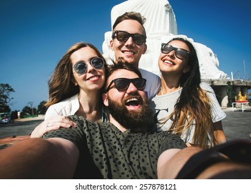 Multiracial Group Of Young Hipster Friends Make Selfie Photo With Smartphone Camera While Traveling Across Asia On Summer Vacation