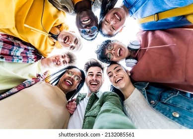 Multiracial Group Of Young People Standing In Circle Smiling At Camera - International Teamwork Students Hugging Together - Human Resources And Youth Culture Concept