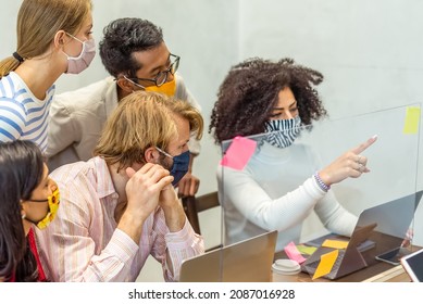 Multiracial Group Of Young Startup Working Together With Protective Face Mask, Co Working Space And Healthy Care In Small Business Office, The New Normal Pandemic Lifestyle 