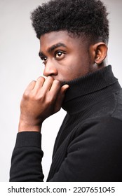 Multiracial Handsome Brunette Man Posing In Black Turtle Neck Sweater And Looking Away Against White Background. Successful Young Man Concept. Vertical Shot 