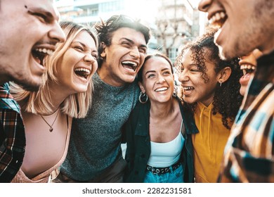 Multiracial happy friends laughing walking outside - Cheerful young people having fun hanging out on summer day - University students smiling standing together in college campus - Backlight filter  - Powered by Shutterstock