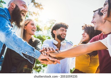 Multiracial Happy Young People Stacking Hands Outside - Diverse Friends Unity Togetherness In Volunteer Community - Concept About University, Relationship, Creative, Youth And Human Resources	