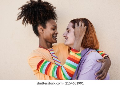 Multiracial Lesbian Women Having Tender Moment At LGBT Pride Parade