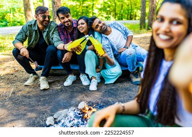 Multiracial pakistanian happy friends at picnic camping park - Shutterstock ID 2252224557