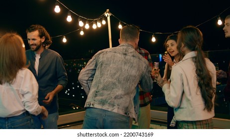 Multiracial people have a party time on the rooftop of terrace they dancing and feeling excited enjoy the time together - Powered by Shutterstock