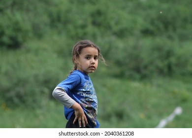 Multiracial Polynesian Child Playing At A Park