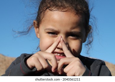 Multiracial Polynesian Child Playing At A Park