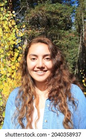 Multiracial Samoan Teen Girl With Fall Tree Colorful Leaves Background