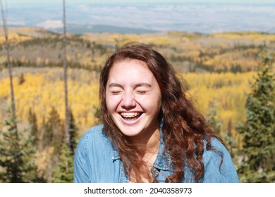 Multiracial Samoan Teen Girl With Fall Tree Colorful Leaves Background