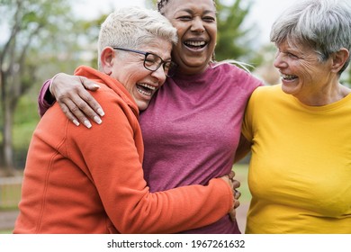 Multiracial senior women having fun together after sport workout outdoor - Main focus on right female face - Shutterstock ID 1967261632