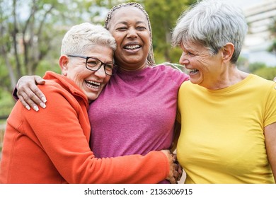 Multiracial senior women having fun together after sport workout outdoor - Focus on left female face - Shutterstock ID 2136306915