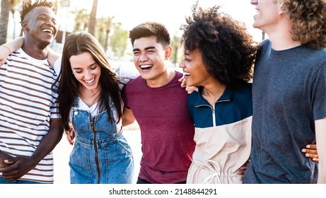 Multiracial Smiling Friends Having Fun Walking On City Street - Happy Young People Laughing And Socializing Hanging Out In A Sunny Day - Friendship Concept With Guys And Girls Enjoying Time Together