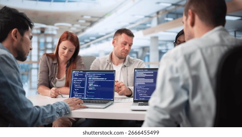 Multiracial Software Engineers Collaborate On Coding Project For Tech Company