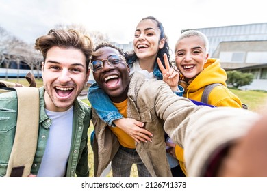 Multiracial Students Company Taking Selfie Portrait In University Campus - Multi Ethnic Best Friends Laughing At Camera Outside - Teens Having Fun Together - Youth Culture And School Concept