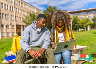 Multiracial students doing homework using laptop sitting outside the university sitting on a bench under the sun - Powered by Shutterstock