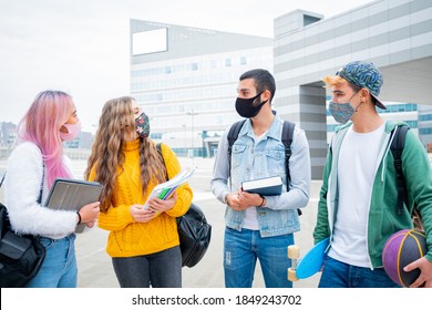 Multiracial Students With Face Mask Studying At College Campus - New Normal Lifestyle Concept With Young Students Having Fun Together Outdoor