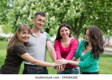 Multiracial Students with Hands on Stack