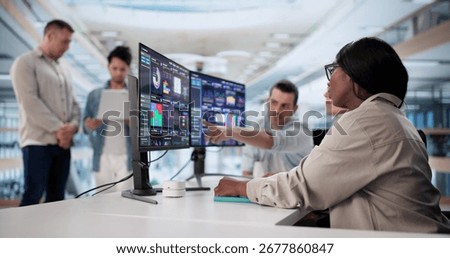 Multiracial Team Predicting Performance Using Analytic Dashboard On Desktop
