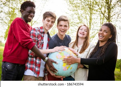 Multiracial Teen Couple Holding Globe Map - Stock