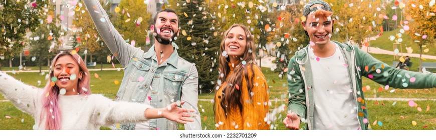 Multiracial teenage ersasmus student group celebrates with confetti. concept about freedom and happiness - Shutterstock ID 2232701209