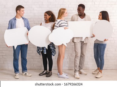 Multiracial teenagers with white communication bubbles having conversation, self-expression concept
