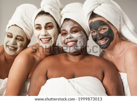 Similar – Multiethnic women with face masks taking selfie