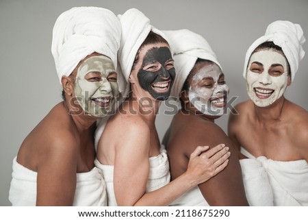 Similar – Multiethnic women with face masks taking selfie