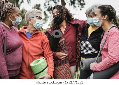 Multiracial Women Having Fun At Park Outdoor While Wearing Protective Mask For Coronavirus Outbreak - Multi Generational People After Yoga Class