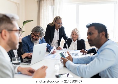 Multiracial Work Group, People Of Different Ages Working Together In The Office