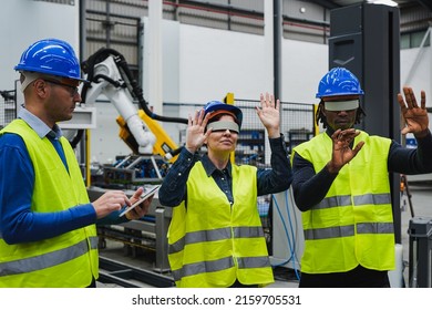 Multiracial working people using digital tablet and virtual reality goggles inside robotic factory - Powered by Shutterstock